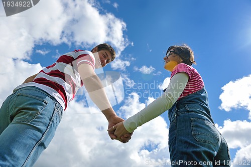 Image of romantic young couple in love together outdoor