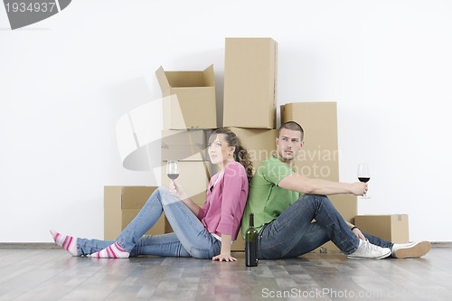 Image of Young couple moving in new home