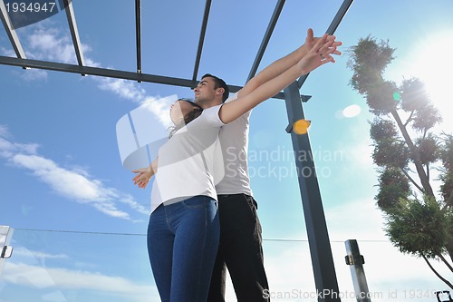 Image of couple relaxing on balcony
