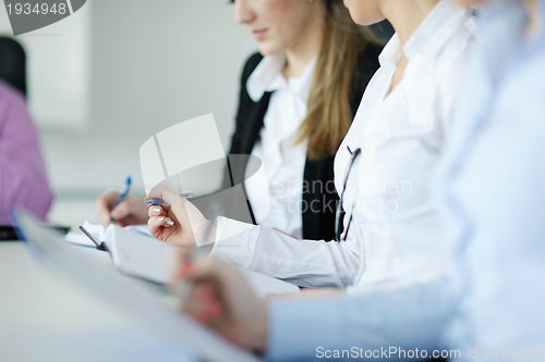 Image of Group of young business people at meeting