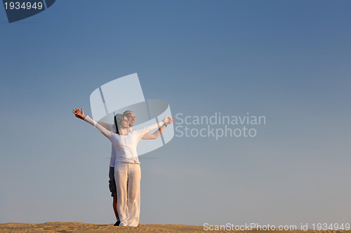 Image of couple enjoying the sunset