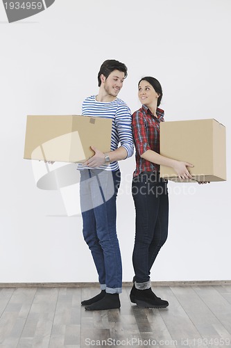 Image of Young couple moving in new home