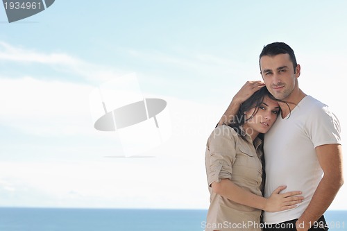 Image of couple relaxing on balcony