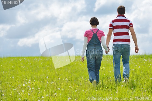 Image of romantic young couple in love together outdoor