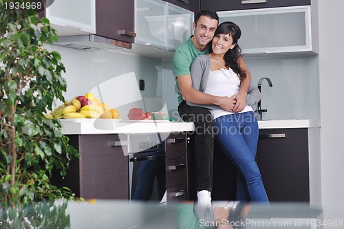 Image of young couple have fun in modern kitchen