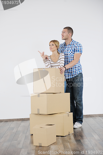 Image of Young couple moving in new house