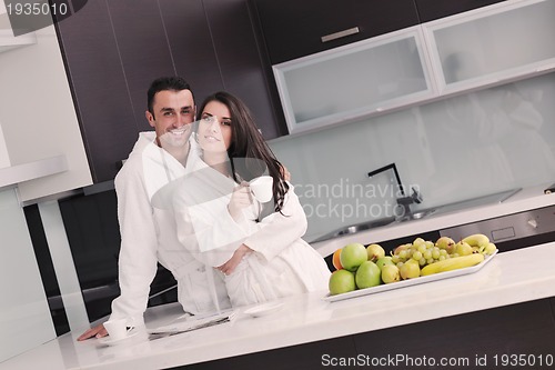 Image of young couple have fun in modern kitchen