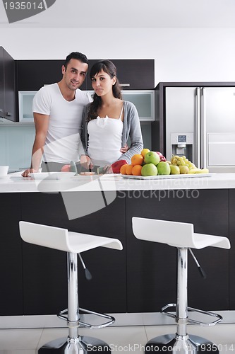 Image of young couple have fun in modern kitchen