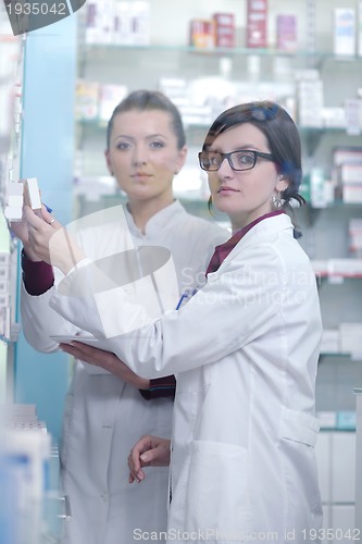 Image of team of pharmacist chemist woman  in pharmacy drugstore