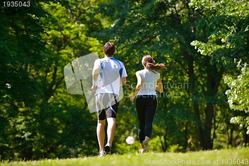 Image of Young couple jogging