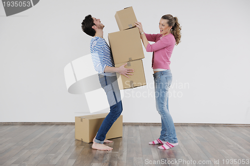 Image of Young couple moving in new house