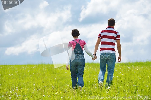 Image of romantic young couple in love together outdoor