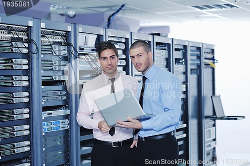 Image of it enineers in network server room