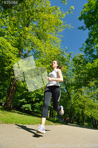 Image of Young beautiful  woman jogging