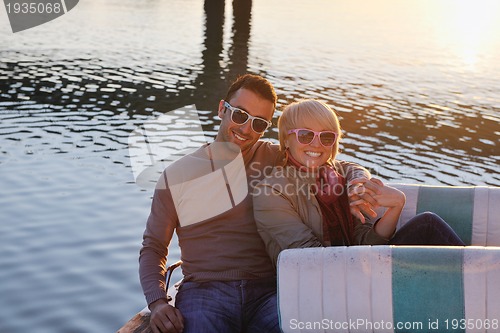 Image of couple in love  have romantic time on boat