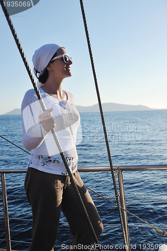 Image of Greek woman on the streets of Oia, Santorini, Greece