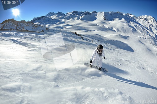 Image of skiing on fresh snow at winter season at beautiful sunny day