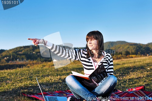 Image of young teen girl work on laptop outdoor