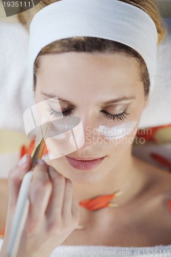 Image of Beautiful young woman in spa