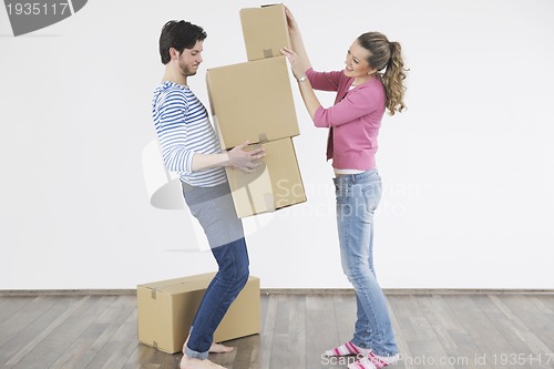 Image of Young couple moving in new home