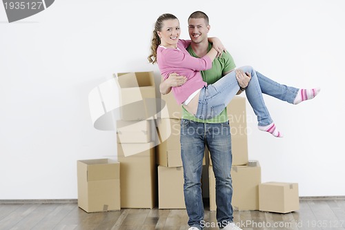 Image of Young couple moving in new home