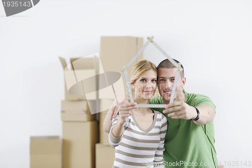 Image of Young couple moving in new home