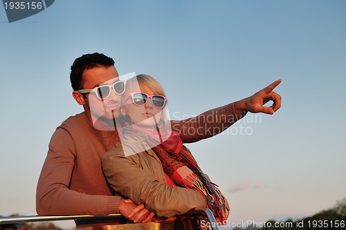 Image of couple in love  have romantic time on boat