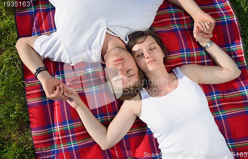 Image of romantic young couple in love together outdoor