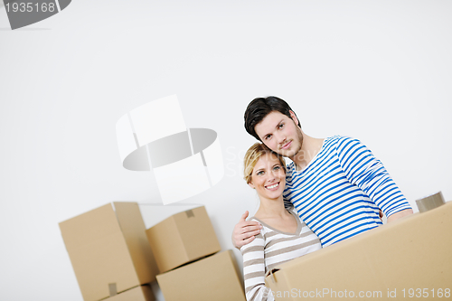 Image of Young couple moving in new house