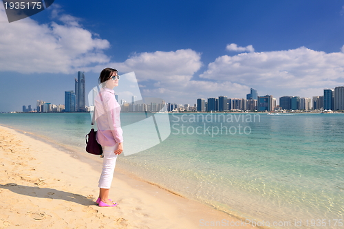 Image of happy tourist woman