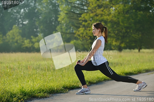 Image of woman stretching before fitness