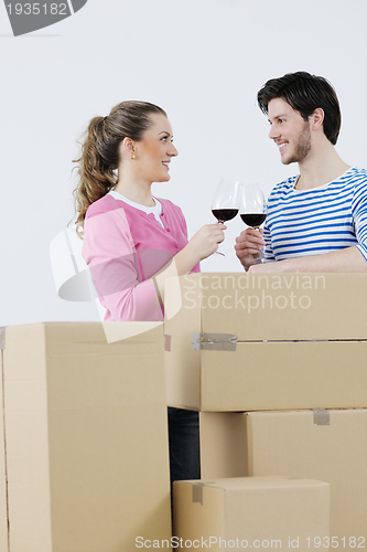 Image of Young couple moving in new home