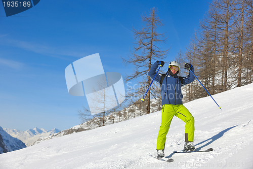 Image of skiing on fresh snow at winter season at beautiful sunny day