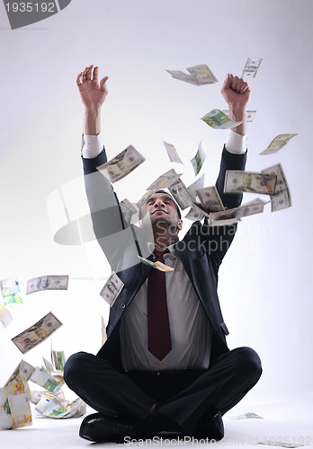 Image of Business man holding money