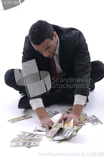 Image of Business man holding money