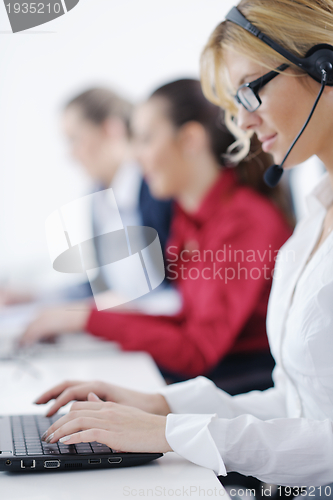 Image of business woman group with headphones