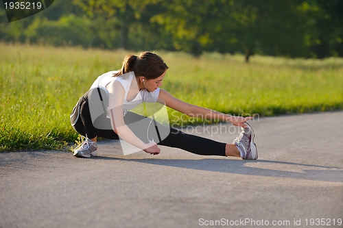 Image of woman stretching before fitness