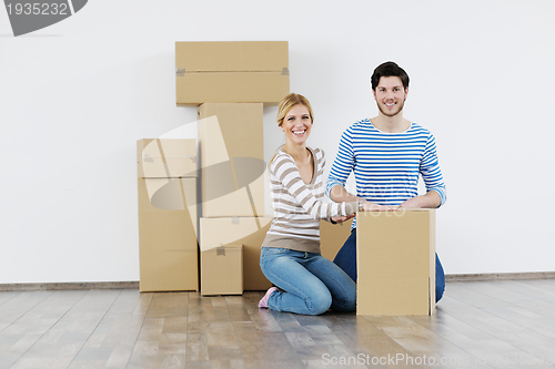 Image of Young couple moving in new house