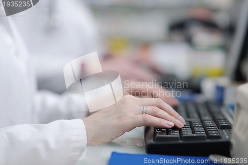 Image of pharmacist suggesting medical drug to buyer in pharmacy drugstor