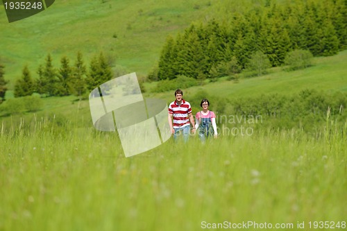 Image of romantic young couple in love together outdoor