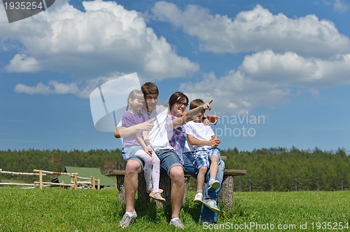Image of happy young family have fun outdoors