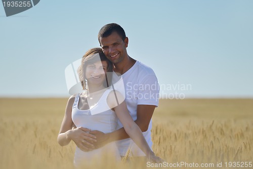 Image of happy couple in wheat field