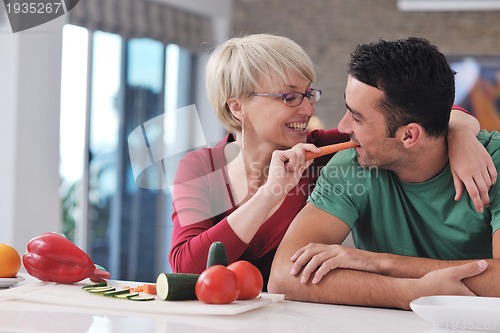 Image of young couple have fun in modern kitchen