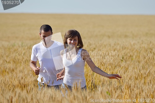 Image of happy couple in wheat field