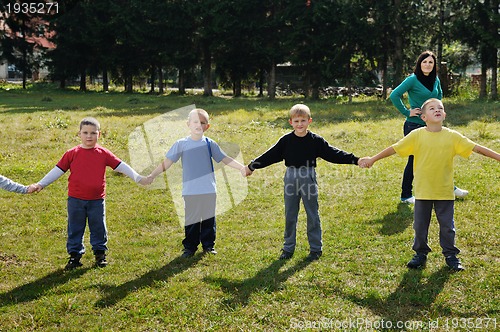 Image of preschool  kids outdoor have fun