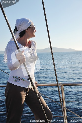 Image of Greek woman on the streets of Oia, Santorini, Greece