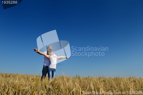 Image of happy couple in wheat field