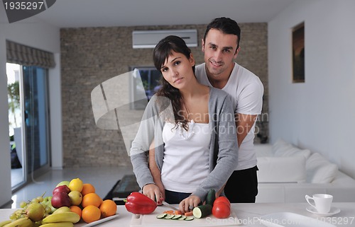 Image of young couple have fun in modern kitchen
