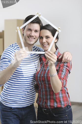 Image of Young couple moving in new home