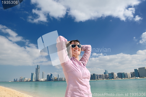 Image of happy tourist woman